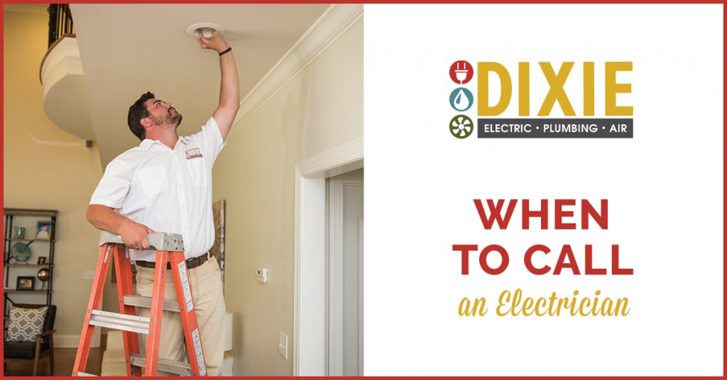 Electrician from Dixie Electric, Plumbing & Air inspecting a home's electrical system